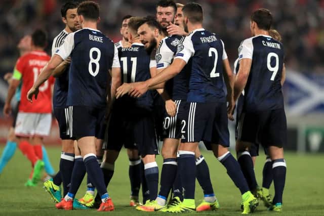Scotland's Robert Snodgrass celebrates scoring his side's third goal of the game from the penalty spot. Picture: PA