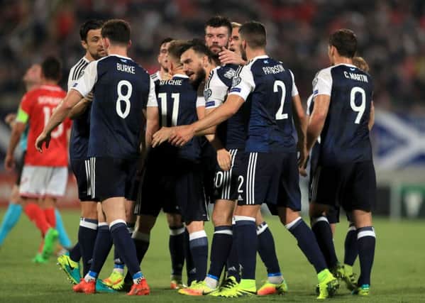 Scotland's Robert Snodgrass celebrates scoring his side's third goal of the game from the penalty spot. Picture: PA