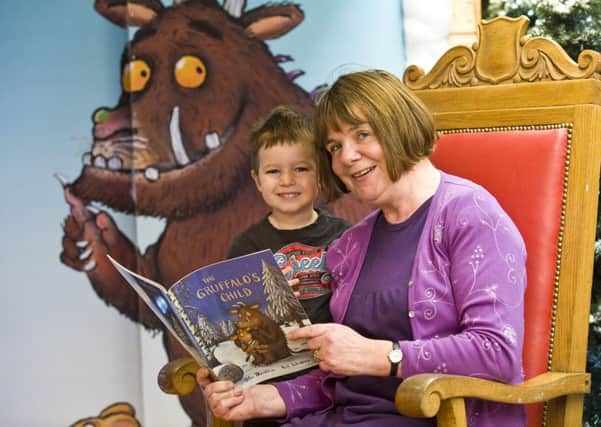 Young reader Tate Woodhouse meets children's author julia Donaldson, who has called for schoo librarians to become mandatory.  Picture: Ian Georgeson