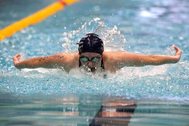 Keanna MacInnes wins the Girls 100m Butterfly. Picture: Steven Paston/PA Wire