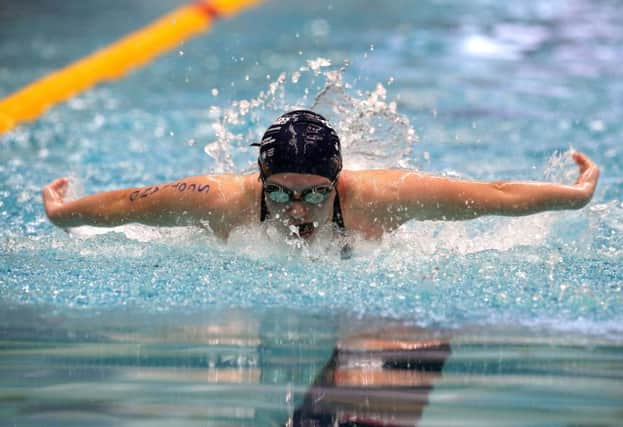 Keanna MacInnes wins the Girls 100m Butterfly. Picture: Steven Paston/PA Wire
