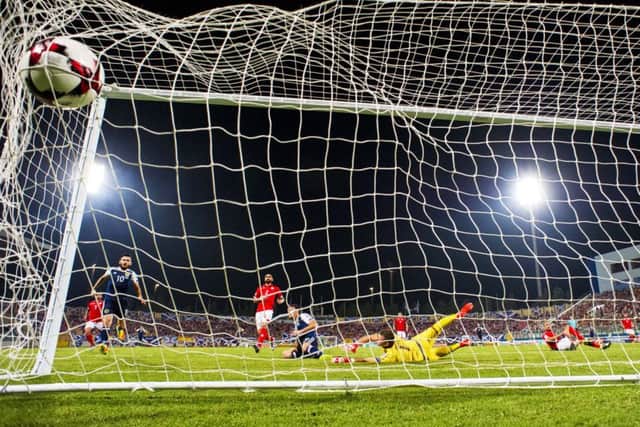 Chris Martin scores to put Scotland back in front and settle a few nerves in Malta. Picture: SNS.
