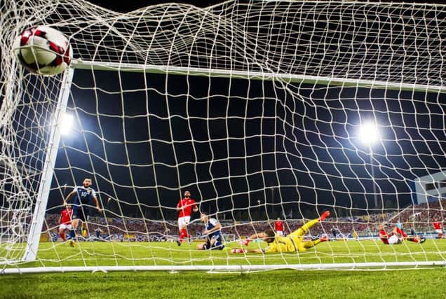 Chris Martin scores to put Scotland back in front and settle a few nerves in Malta. Picture: SNS.