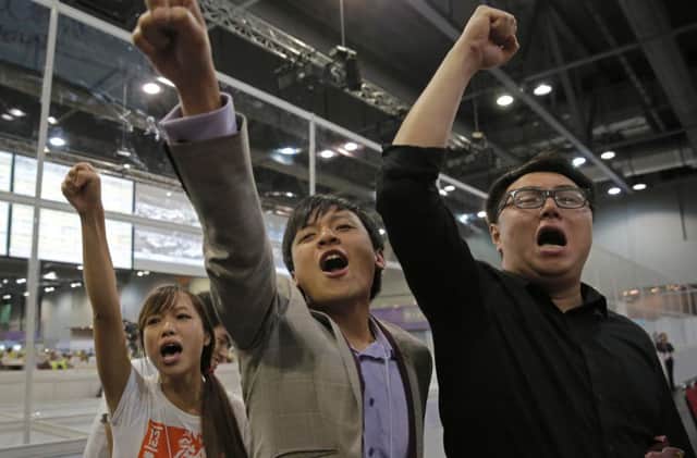 Radical activist candidates celebrate after their legislative council election victory in Hong Kong. Picture: AP