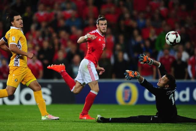 Gareth Bale scores the first of his two goals against Moldova. Picture: Getty.