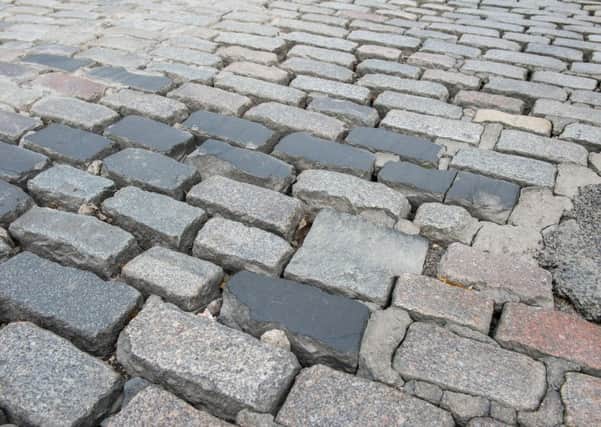 Aberdeen's Windmill Brae cobbles are covered by tar. Picture: Ian Georgeson