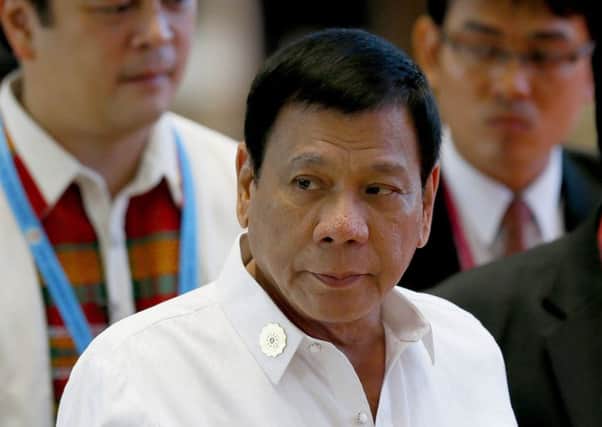 Philippine President Rodrigo Duterte says he doesnt want to fight with Barack Obama. Picture: AP