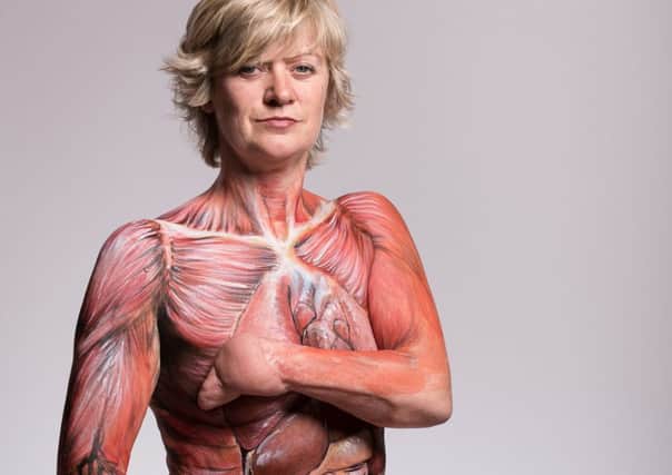 Corinne Hutton  with her body painted with organs and tissue that are deemed transplantable. Picture: PA