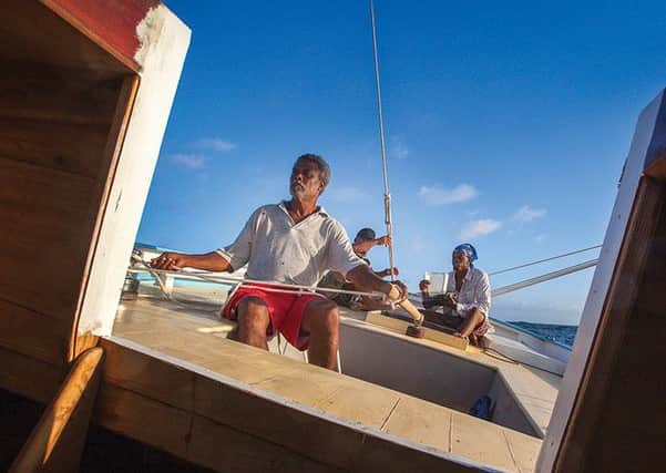Boat builder Alwyn Enoe in a still from Vanishing Sail