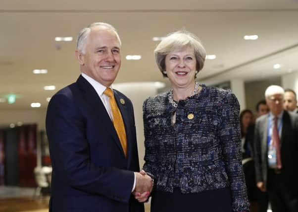 British Prime Minister Theresa May, right, meets Australian Prime Minister Malcolm Turnbull