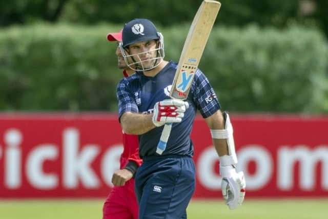 Scotland's Kyle Cotzer signals his 50 knock. Picture: Donald MacLeod/ICC