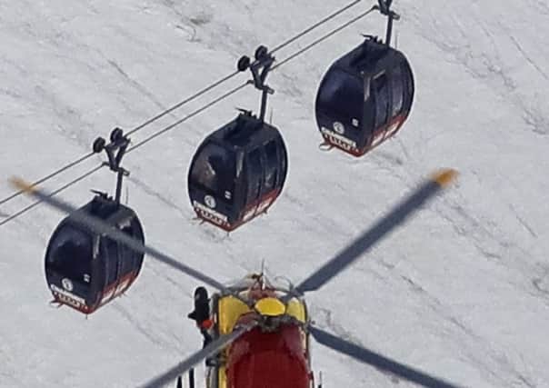 The cable car carrying tourists stopped working at high altitude over the Mont Blanc massif in the Alps. Picture: AP