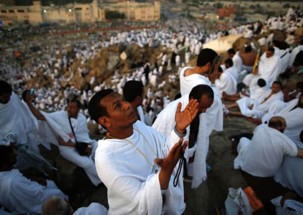 Some of the two million Muslim pilgrims join one of the Hajj rituals on Mount Arafat near Mecca early yesterday morning. Picture: AFP/Getty