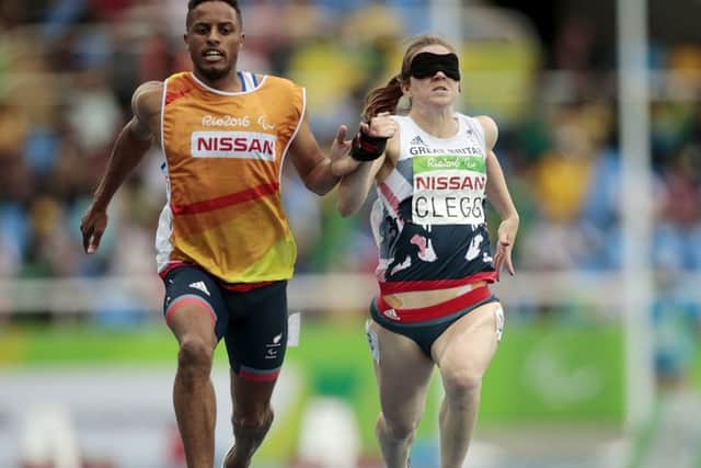 Libby Clegg's guide Chris Clarke was accused of pulling her to victory in the women's 100m T11 semi-finals at the Paralympic Games.  Picture: Alexandre Loureiro/Getty Images