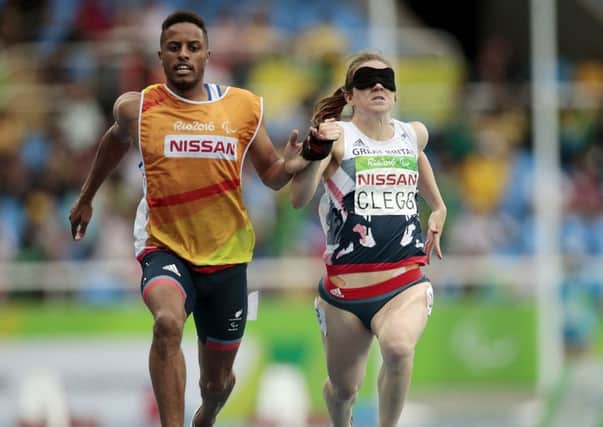 Libby Clegg's guide Chris Clarke was accused of pulling her to victory in the women's 100m T11 semi-finals at the Paralympic Games.  Picture: Alexandre Loureiro/Getty Images