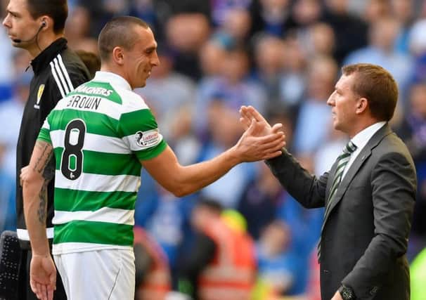 Celtic manager Brendan Rodgers shakes hands with captain Scott Brown.  Picture: Jeff J Mitchell/Getty Images