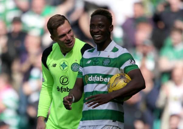 Celtic Moussa Dembele, right, celebrates with Dorus De Vries after the final whistle. Picture: Andrew Milligan/PA Wire