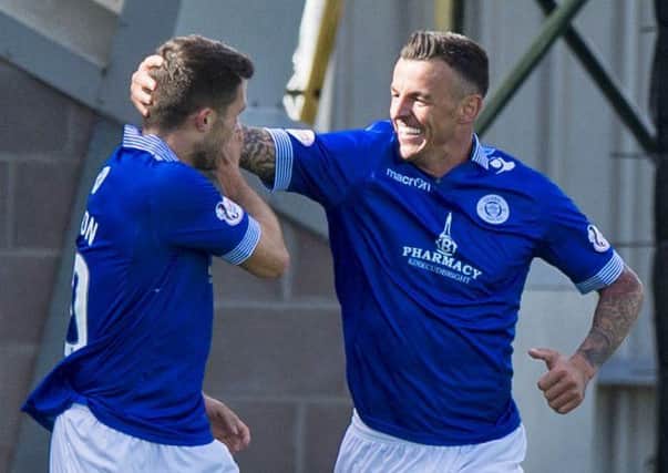 Derek Lyle, right, celebrates after firing home to give Queen of the South the lead against St Mirren. Picture: Sammy Turner/SNS