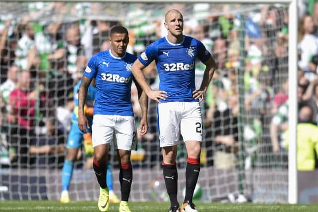 Philippe Senderos cuts a dejected figure during the rout at Parkhead. Picture: SNS Group / Rob Casey