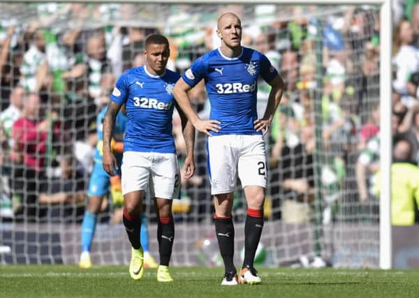Philippe Senderos cuts a dejected figure during the rout at Parkhead. Picture: SNS Group / Rob Casey