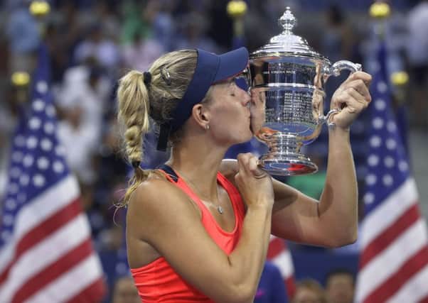 Angelique Kerber, of Germany, kisses the championship trophy after beating Karolina Pliskova, of the Czech Republic, to win the women's singles final at the US Open. Picture: Darron Cummings/AP