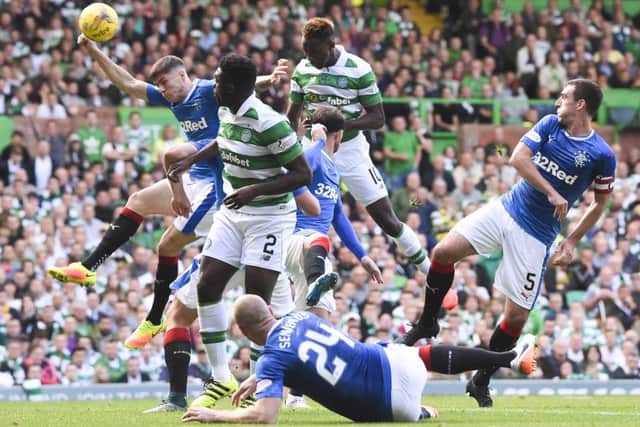 Moussa Dembele rises above everyone to head Celtic into the lead. Picture: Craig Williamson/SNS