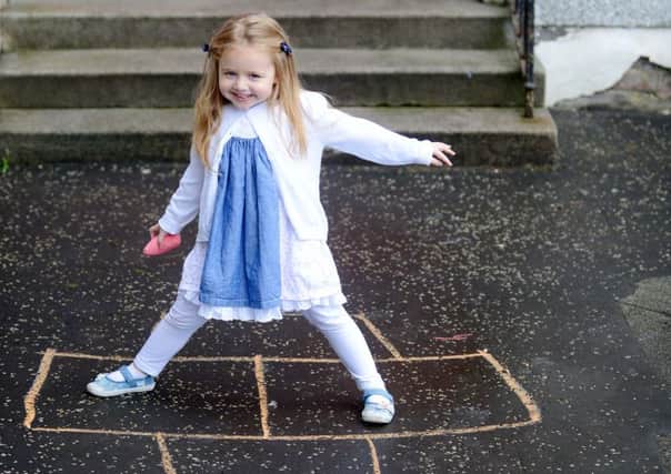 Three-year-old Amelia Hart, who had been playing hopscotch using chalk marks on the pavement. Picture: SWNS