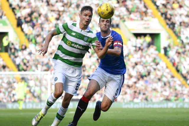 Rangers captain Lee Wallace challenges Celtic's Mikael Lustig. Picture: Rob Casey/SNS