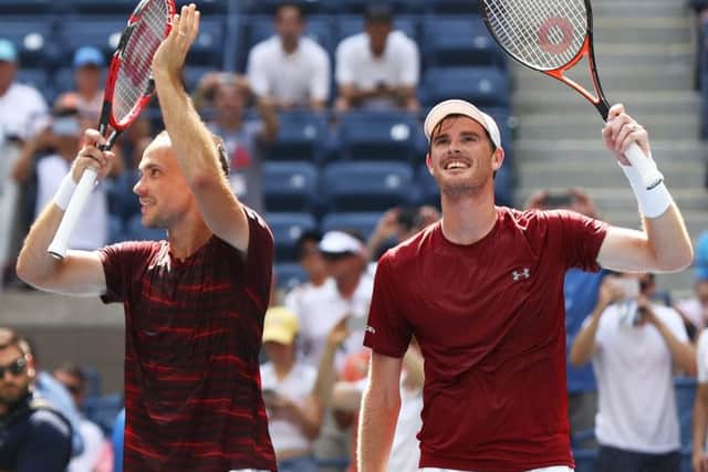 Jamie Murray (right) and Bruno Soares acknowledge the Flushing Meadows crowd, before sealing their US Open win with a kiss of the trophy. Picture: Getty