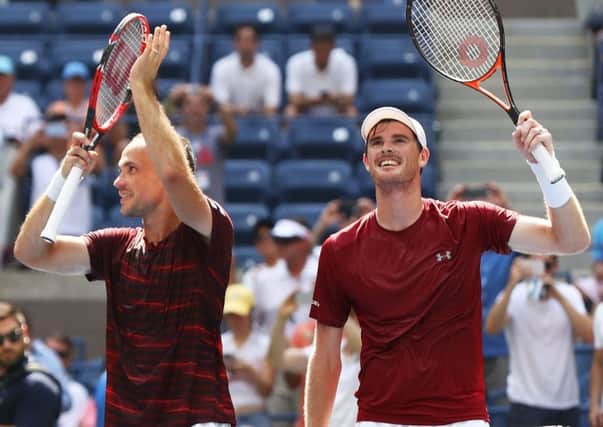 Jamie Murray (right) and Bruno Soares acknowledge the Flushing Meadows crowd, before sealing their US Open win with a kiss of the trophy. Picture: Getty