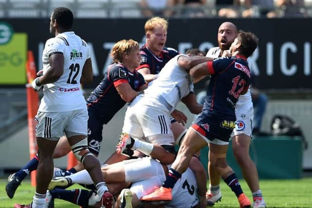 Grenoble's and Brive's players fight during the French Top 14 match at the Stade des Alpes. Picture: Jean-Pierre Clatot/AFP/Getty Images