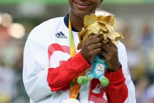 Kadeena Cox celebrates on the podium after winning the women's C4-5 500m Time Trial at the Rio Paralympics. Picture: Getty