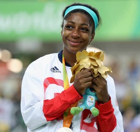 Kadeena Cox celebrates on the podium after winning the women's C4-5 500m Time Trial at the Rio Paralympics. Picture: Getty