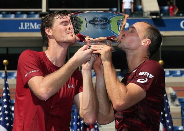 Jamie Murray and Bruno Soares celebrate with the trophy after winning the US Open. Picture: Getty