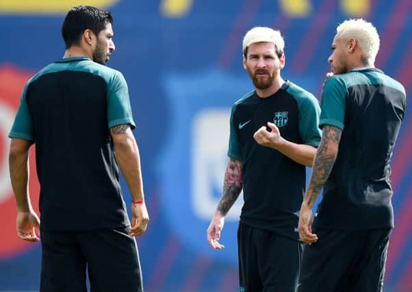 Luis Suarez, Neymar and Lionel Messi chat during training ahead of the Champions League Group C match against Celtic. Picture: David Ramos/Getty Images