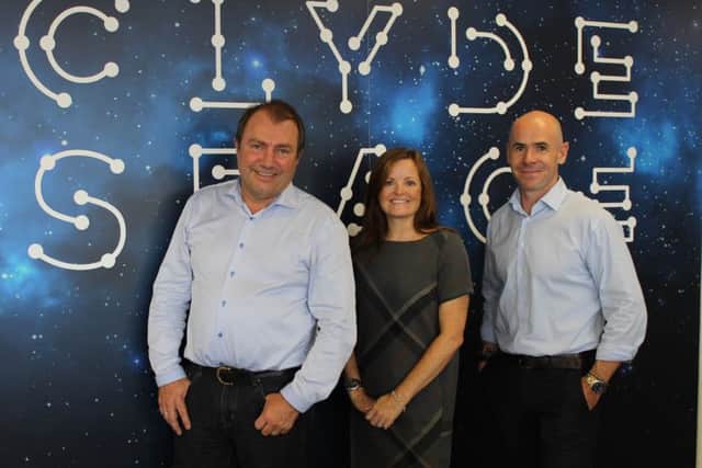 Will Whitehorn, left, with Jennifer Riddell-Dillet and Clyde Space chief executive Craig Clark. Picture: Contributed