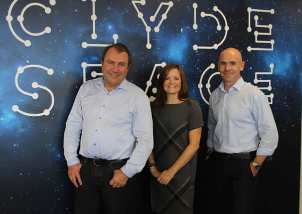 Will Whitehorn, left, with Jennifer Riddell-Dillet and Clyde Space chief executive Craig Clark. Picture: Contributed