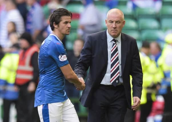 Rangers manager Mark Warburton, right, pictured alongside midfielder Joey Barton, has vowed to turn it around at Rangers. Pic: PA