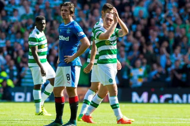 Scott Brown and Celtic emerged victorious over Joey Barton and Rangers in the Old Firm derby. Picture: SNS
