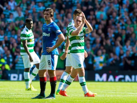 Scott Brown and Celtic emerged victorious over Joey Barton and Rangers in the Old Firm derby. Picture: SNS