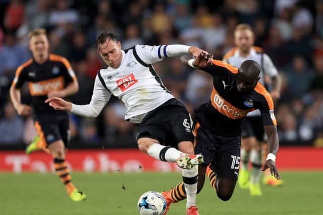 Derby County's Richard Keogh, left, and Newcastle United's Mohamed Diame battle for the ball during a Sky Bet Championship match at the iPro Stadium. Picture: Tim Goode/PA Wire