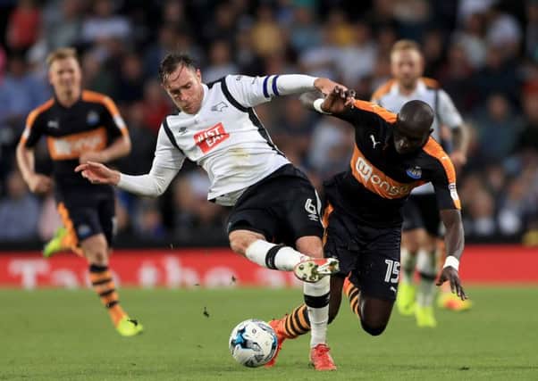 Derby County's Richard Keogh, left, and Newcastle United's Mohamed Diame battle for the ball during a Sky Bet Championship match at the iPro Stadium. Picture: Tim Goode/PA Wire