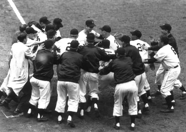 Bobby Thomson (back and centre) is congratulated by the New York Giants after his 'shot heard around the world'. Picture: Contributed