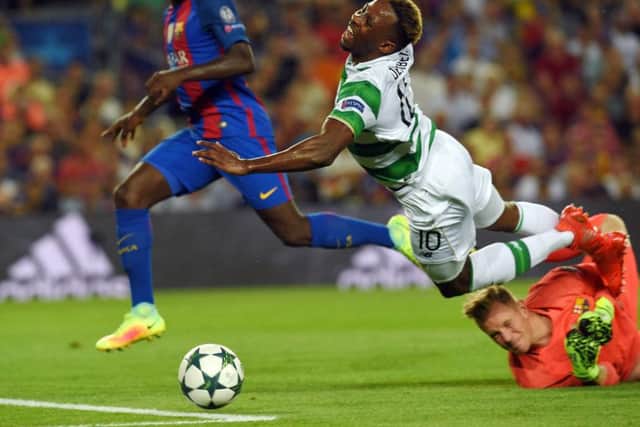 Moussa Dembele wins the penalty for Celtic that he would later miss. Picture: AFP/Getty