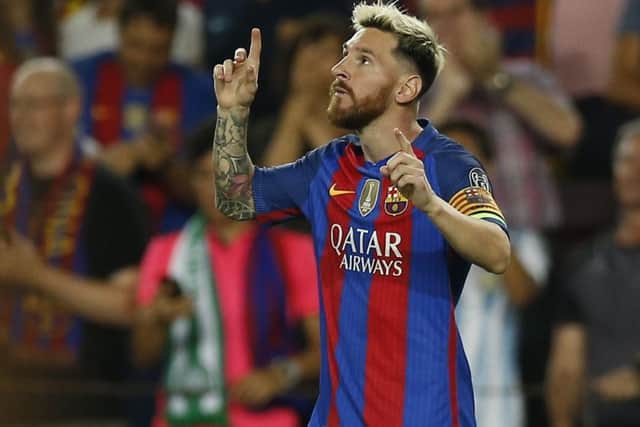 Lionel Messi celebrates. The Argentine bagged a hat-trick on the night. Picture: AP