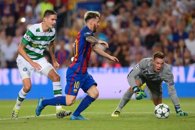 Mikael Lustig, right, and Dorus de Vries, left, look on despairingly as Lionel Messi nets for Barcelona. Picture: AFP/Getty