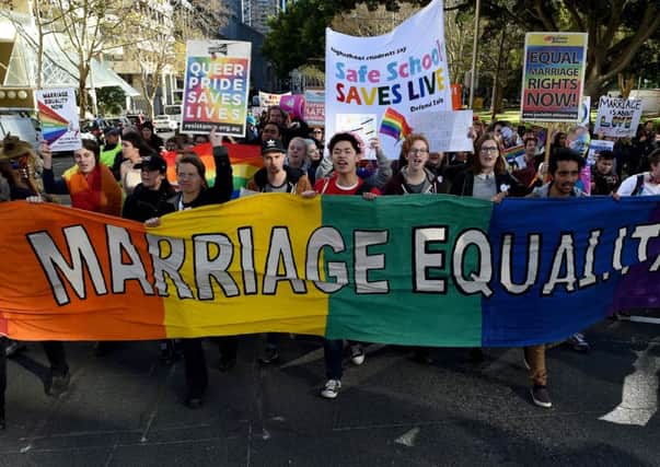 Pro-gay marriage supporters at a rally in Sydney. Picture: AFP/Getty Images