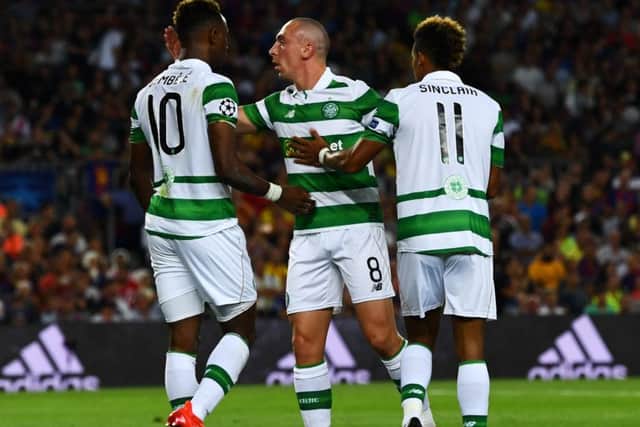 Scott Sinclair, right, along with Scott Brown and Moussa Dembele during last night's game. Picture: Getty