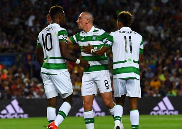 Scott Sinclair, right, along with Scott Brown and Moussa Dembele during last night's game. Picture: Getty