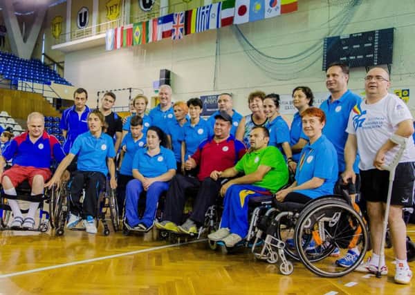 Sally Wood-Lamont (back row, fifth from right) with members of the Romanian Paralympic team